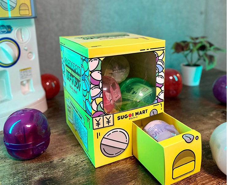 Sugoi Mart mini yellow colored gachapon box with small drawer open.