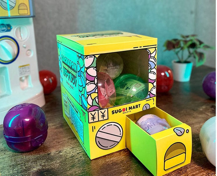 Sugoi Mart mini yellow colored gachapon box with small drawer open.