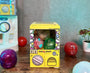 Sugoi Mart mini yellow colored gachapon box with grey background. thumbnail 2